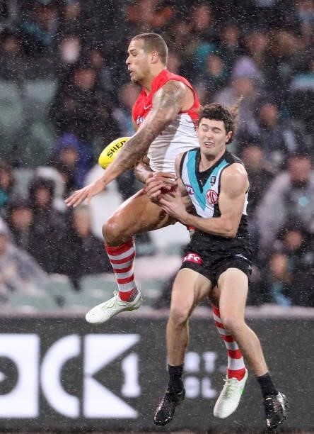 Lance Franklin of the Swans and Darcy Byrne-Jones of the Power during the 2021 AFL Round 15 match between the Port Adelaide Power and the Sydney...