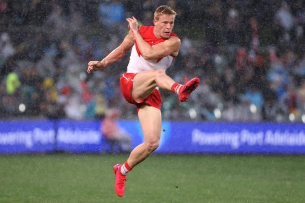 Isaac Heeney of the Swans kicks the ball during the 2021 AFL Round 15 match between the Port Adelaide Power and the Sydney Swans at Adelaide Oval on...
