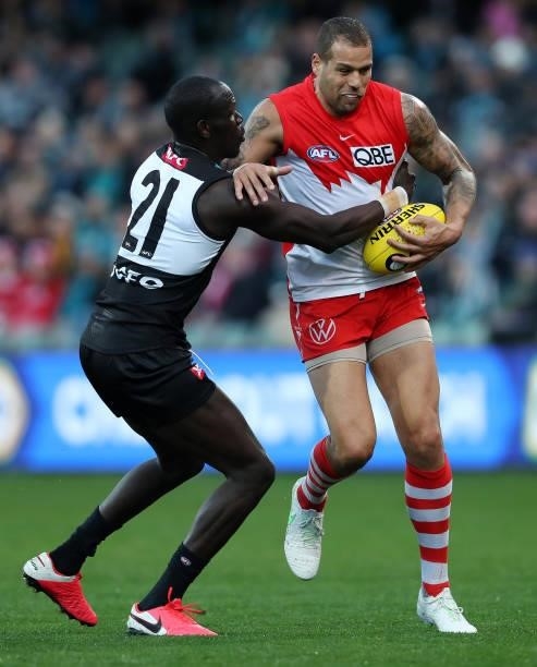 Aliir Aliir of the Power and Lance Franklin of the Swans during the 2021 AFL Round 15 match between the Port Adelaide Power and the Sydney Swans at...