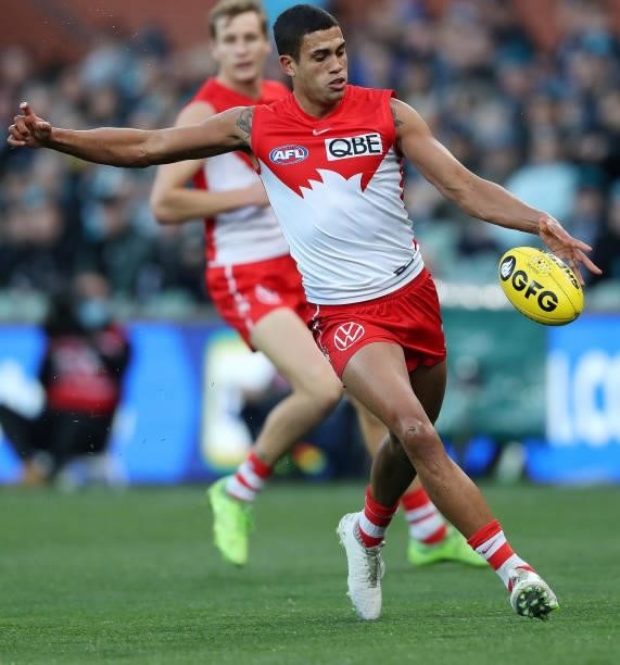 James Bell of the Swans kicks the ball during the 2021 AFL Round 15 match between the Port Adelaide Power and the Sydney Swans at Adelaide Oval on...