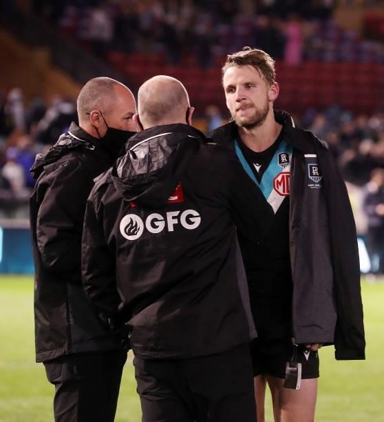 Trent McKenzie with Ken Hinkley and Brett Montgomery after the win during the 2021 AFL Round 15 match between the Port Adelaide Power and the Sydney...