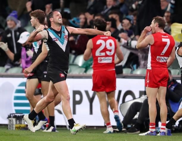 Travis Boak of the Power celebrates on the siren during the 2021 AFL Round 15 match between the Port Adelaide Power and the Sydney Swans at Adelaide...