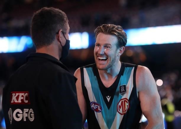 Tom Jonas all smiles after the win with Nathan Bassett during the 2021 AFL Round 15 match between the Port Adelaide Power and the Sydney Swans at...
