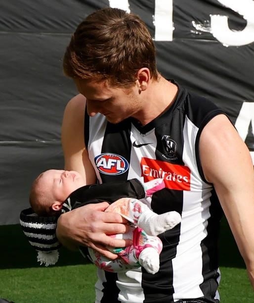 Will Hoskin-Elliott of the Magpies and daughter Ivy are seen during the 2021 AFL Round 15 match between the Collingwood Magpies and the Fremantle...