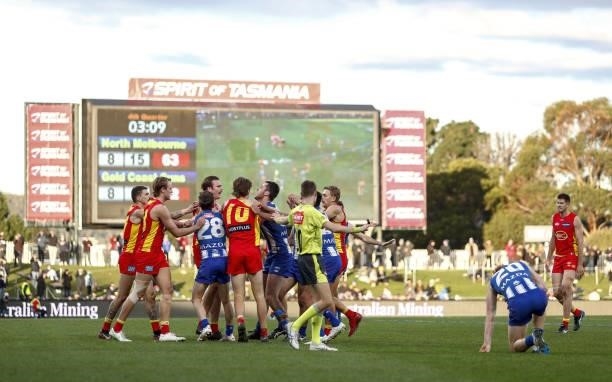Players remonstrate during the 2021 AFL Round 15 match between the North Melbourne Kangaroos and the Gold Coast Suns at Blundstone Arena on June 26,...