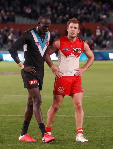 Aliir Aliir of the Power with Luke Parker of the Swans after the game during the 2021 AFL Round 15 match between the Port Adelaide Power and the...