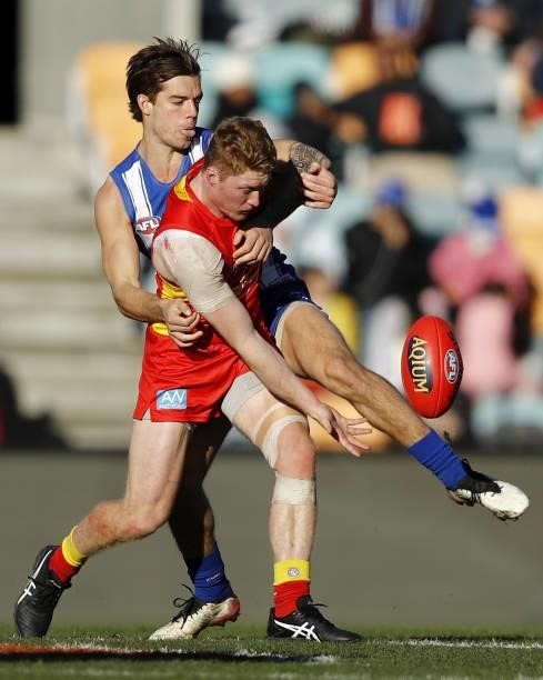Jy Simpkin of the Kangaroos and Matt Rowell of the Suns compete for the ball during the 2021 AFL Round 15 match between the North Melbourne Kangaroos...