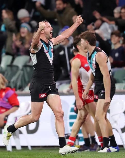 Travis Boak of the Power celebrates on the siren during the 2021 AFL Round 15 match between the Port Adelaide Power and the Sydney Swans at Adelaide...
