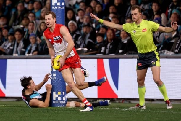 Connor Rozee of the Power hits the post trying to tackle Harry Cunningham of the Swans during the 2021 AFL Round 15 match between the Port Adelaide...