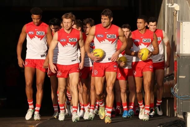 The Swans run out during the 2021 AFL Round 15 match between the Port Adelaide Power and the Sydney Swans at Adelaide Oval on June 26, 2021 in...