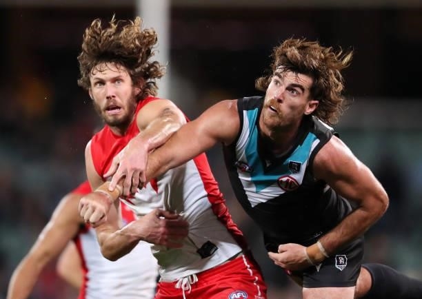 Scott Lycett of the Power and Tom Hickey of the Swans in action during the 2021 AFL Round 15 match between the Port Adelaide Power and the Sydney...