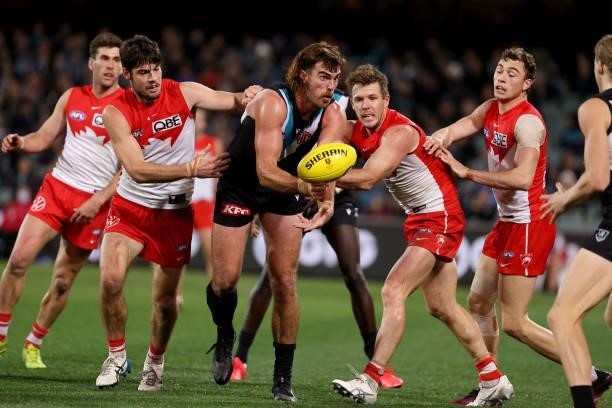 George Hewett of the Swans tackle Scott Lycett of the Power in action during the 2021 AFL Round 15 match between the Port Adelaide Power and the...