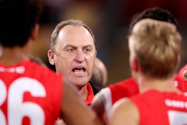 John Longmire, Senior Coach of the Swans gives instructions during the 2021 AFL Round 15 match between the Port Adelaide Power and the Sydney Swans...