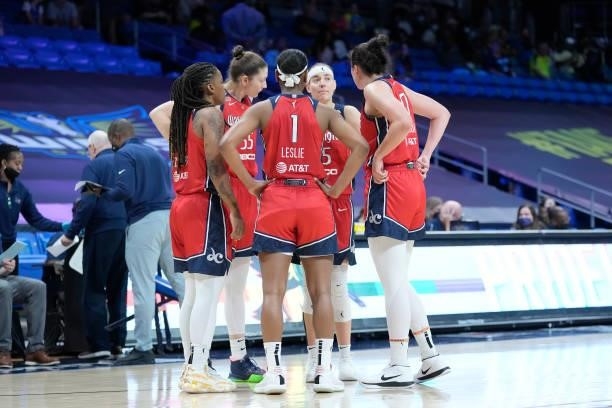 The Washington Mystics huddle up during the game against the Dallas Wings on June 26, 2021 at the College Park Center in Arlington, Texas. NOTE TO...
