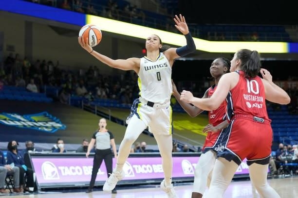 Satou Sabally of the Dallas Wings drives to the basket against the Washington Mystics on June 26, 2021 at the College Park Center in Arlington,...