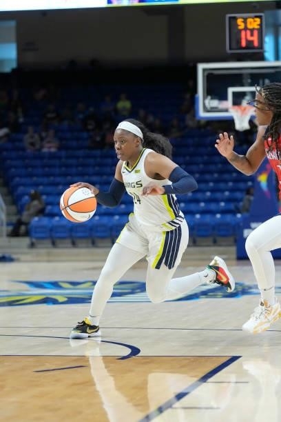 Arike Ogunbowale of the Dallas Wings dribbles the ball against the Washington Mystics on June 26, 2021 at the College Park Center in Arlington,...