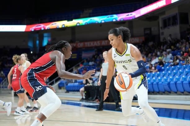 Satou Sabally of the Dallas Wings dribbles the ball against the Washington Mystics on June 26, 2021 at the College Park Center in Arlington, Texas....