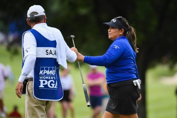 Lizette Salas fist bumps her caddie on the seventh hole during the third round for the 2021 KPMG Women's Championship at the Atlanta Athletic Club on...