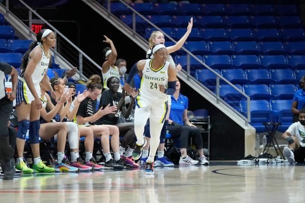 The Dallas Wings celebrate during the game against the Washington Mystics on June 26, 2021 at the College Park Center in Arlington, Texas. NOTE TO...
