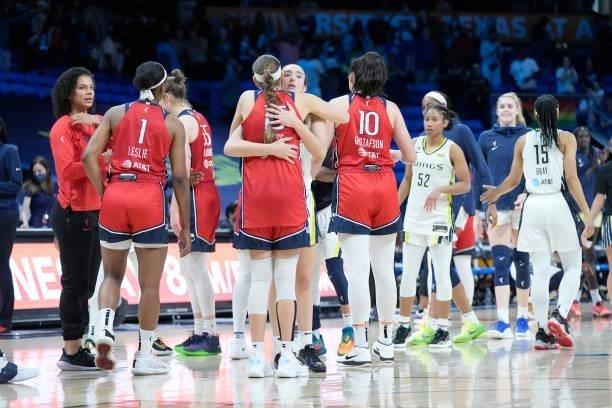 Marina Mabrey of the Dallas Wings and Sydney Wiese of the Washington Mystics hug after the game on June 26, 2021 at the College Park Center in...