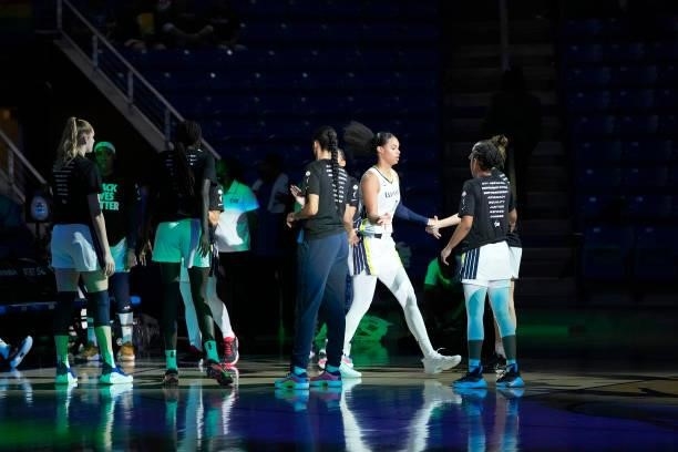 Satou Sabally of the Dallas Wings high fives her teammates before the game against the Washington Mystics on June 26, 2021 at the College Park Center...