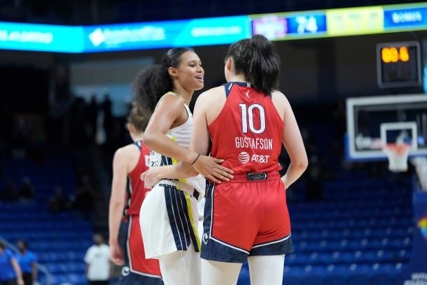 Satou Sabally of the Dallas Wings and Megan Gustafson of the Washington Mystics talk after the game on June 26, 2021 at the College Park Center in...