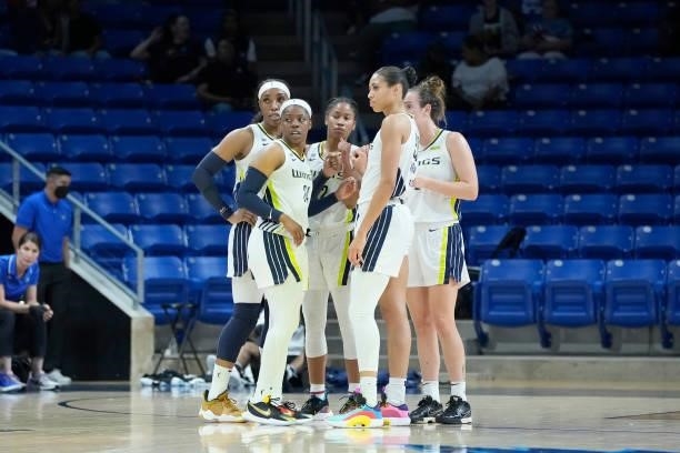 The Dallas Wings huddle up during the game against the Washington Mystics on June 26, 2021 at the College Park Center in Arlington, Texas. NOTE TO...