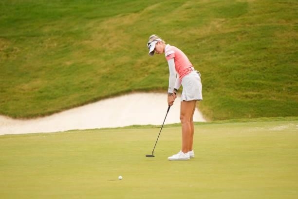 Nelly Korda makes her putt on the 18th hole during the third round for the 2021 KPMG Women's Championship at the Atlanta Athletic Club on June 26,...