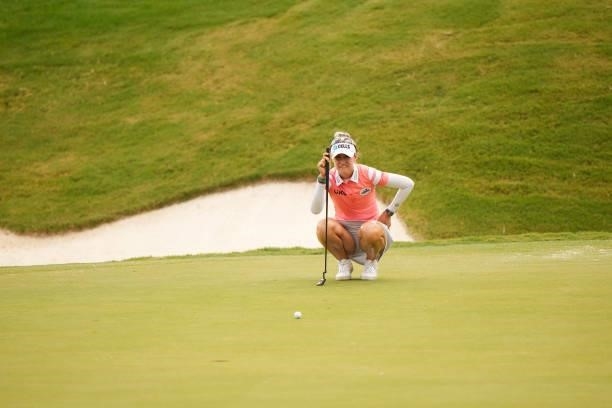 Nelly Korda reads her putt on the 18th hole during the third round for the 2021 KPMG Women's Championship at the Atlanta Athletic Club on June 26,...