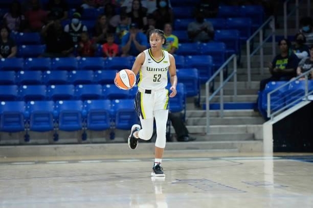 Tyasha Harris of the Dallas Wings dribbles the ball during the game against the Washington Mystics on June 26, 2021 at the College Park Center in...