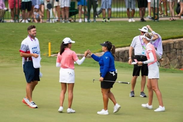 Celine Boutier of France fist bumps Lizette Salas on the 18th hole during the third round for the 2021 KPMG Women's Championship at the Atlanta...