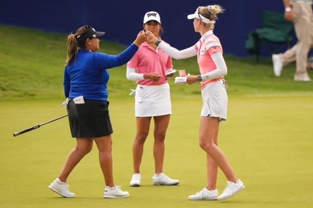Lizette Salas and Nelly Korda fist bump on the 18th hole during the third round for the 2021 KPMG Women's Championship at the Atlanta Athletic Club...