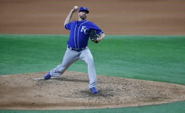 Wade Davis of the Kansas City Royals pitches against the Texas Rangers during the seventh inning at Globe Life Field on June 26, 2021 in Arlington,...