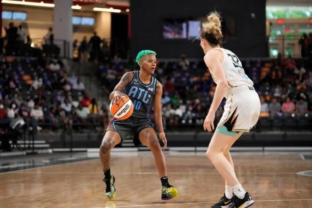 Courtney Williams of the Atlanta Dream handles the ball against the New York Liberty on June 26, 2021 at Gateway Center Arena in College Park,...