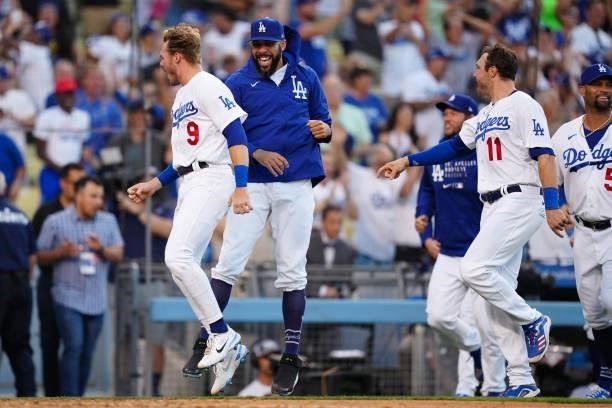 The Los Angeles Dodgers celebrate a Cody Bellinger walk-off home run during the game between the Chicago Cubs and the Los Angeles Dodgers at Dodgers...
