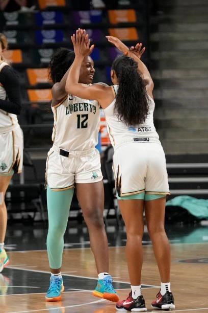 Michaela Onyenwere of the New York Liberty high fives her teammate before the game against the Atlanta Dream on June 26, 2021 at Gateway Center Arena...