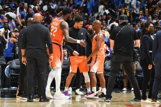 Deandre Ayton of the Phoenix Suns and Devin Booker of the Phoenix Suns greet Chris Paul of the Phoenix Suns after the game against the LA Clippers...