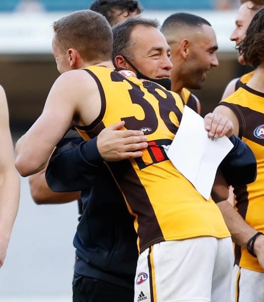 Denver Grainger-Barras of the Hawks and Alastair Clarkson, Senior Coach of the Hawks embrace during the 2021 AFL Round 15 match between the GWS...