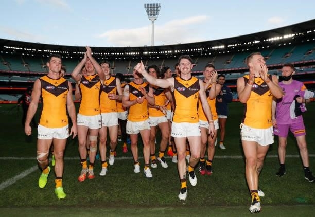 The Hawks celebrate during the 2021 AFL Round 15 match between the GWS Giants and the Hawthorn Hawks at the Melbourne Cricket Ground on June 27, 2021...