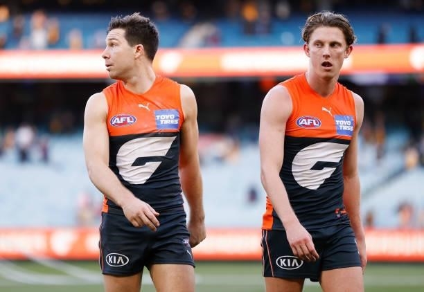 Toby Greene and Lachie Whitfield of the Giants look dejected after a loss during the 2021 AFL Round 15 match between the GWS Giants and the Hawthorn...