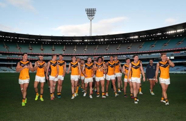 The Hawks celebrate during the 2021 AFL Round 15 match between the GWS Giants and the Hawthorn Hawks at the Melbourne Cricket Ground on June 27, 2021...