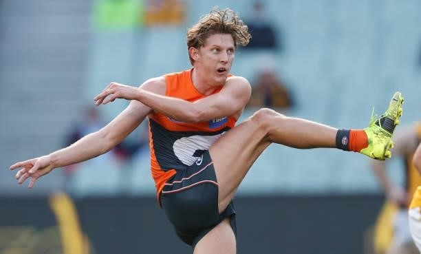 Lachie Whitfield of the Giants kicks the ball during the 2021 AFL Round 15 match between the GWS Giants and the Hawthorn Hawks at the Melbourne...