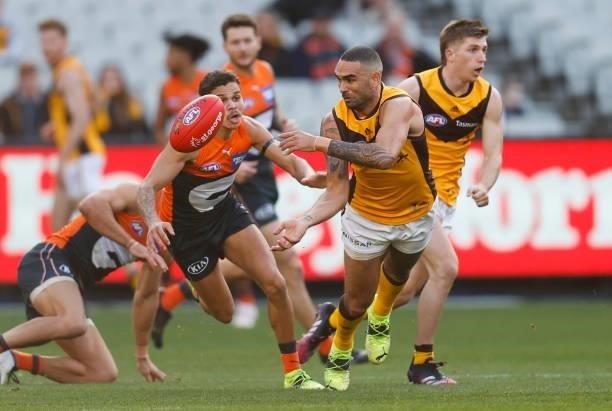 Shaun Burgoyne of the Hawks handpasses the ball during the 2021 AFL Round 15 match between the GWS Giants and the Hawthorn Hawks at the Melbourne...