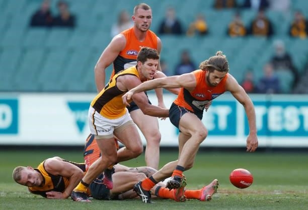 Callan Ward of the Giants and Luke Breust of the Hawks compete for the ball during the 2021 AFL Round 15 match between the GWS Giants and the...