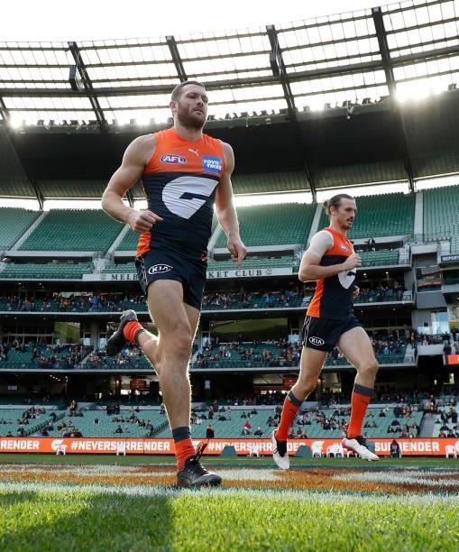 Sam J. Reid and Phil Davis of the Giants in action during the 2021 AFL Round 15 match between the GWS Giants and the Hawthorn Hawks at the Melbourne...