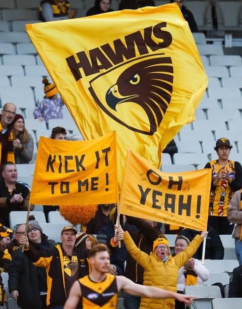 Hawks fans cheer during the 2021 AFL Round 15 match between the GWS Giants and the Hawthorn Hawks at the Melbourne Cricket Ground on June 27, 2021 in...