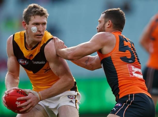 Ben McEvoy of the Hawks and Sam J. Reid of the Giants in action during the 2021 AFL Round 15 match between the GWS Giants and the Hawthorn Hawks at...