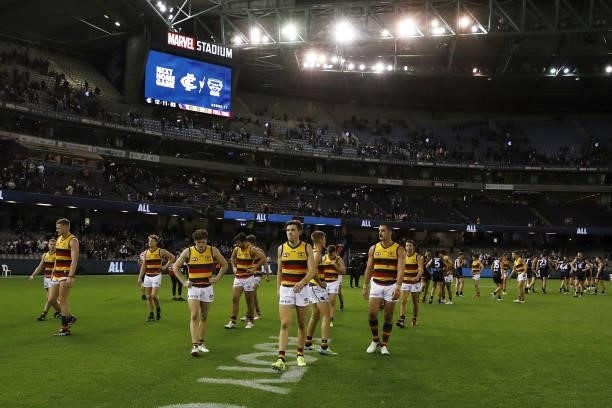 Adelaide Crows players leave the field after a loss during the 2021 AFL Round 15 match between the Carlton Blues and the Adelaide Crows at Marvel...