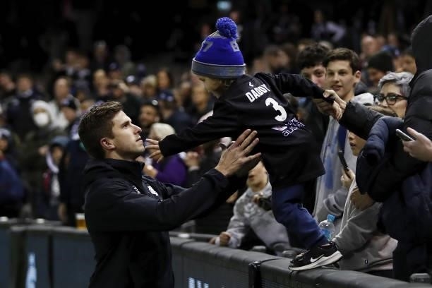 Marc Murphy of the Blues is seen with his son Max Murphy after the 2021 AFL Round 15 match between the Carlton Blues and the Adelaide Crows at Marvel...