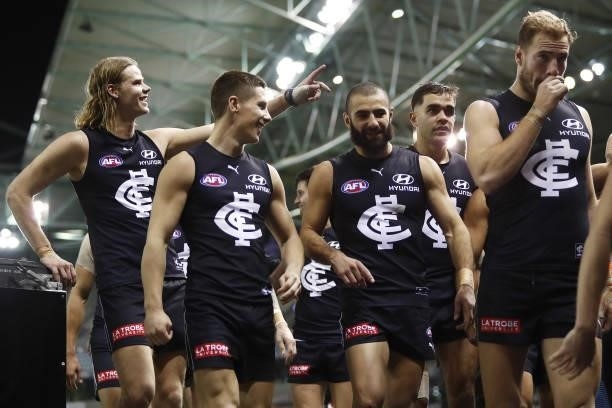 Carlton players leave the field after a win during the 2021 AFL Round 15 match between the Carlton Blues and the Adelaide Crows at Marvel Stadium on...